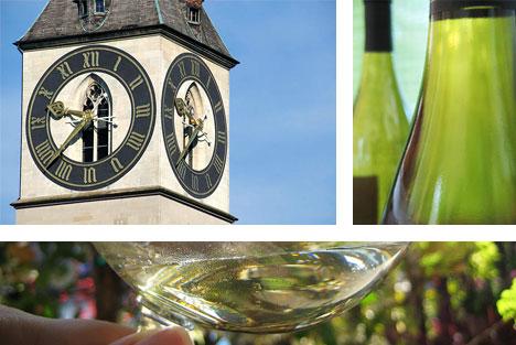 St. Peter's clock, Zurich, Switzerland, wine glasses, and wine bottle. Image by A. Haenni